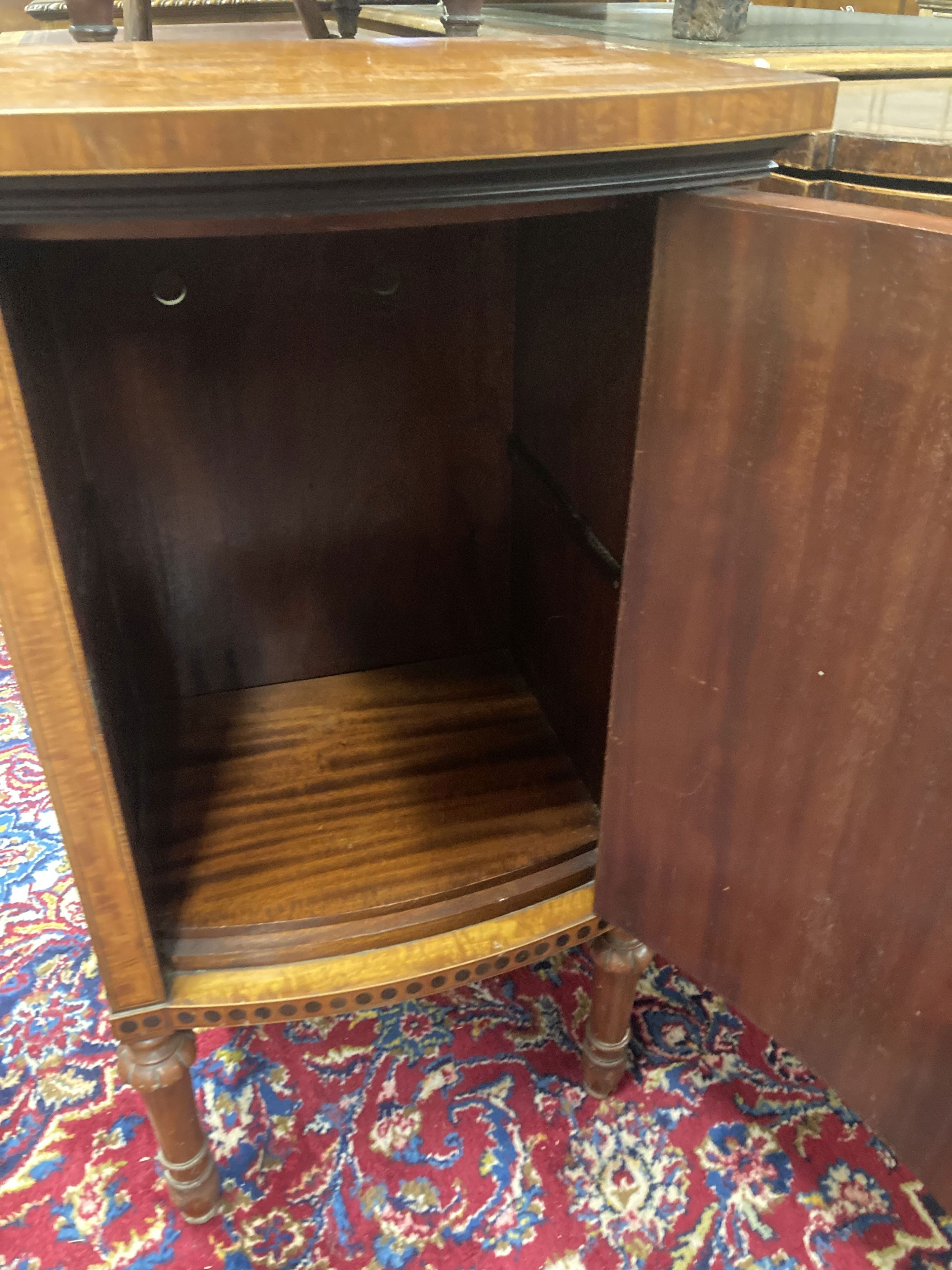 An Edwardian Sheraton revival painted satinwood bow front bedside cabinet, width 44cm, depth 39cm, height 78cm